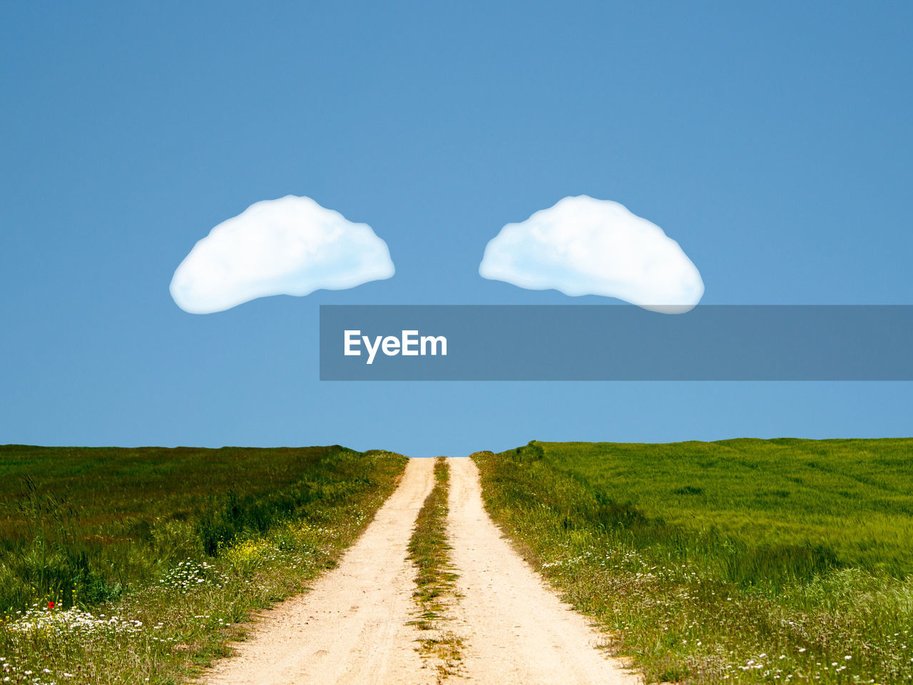 ROAD AMIDST FIELD AGAINST SKY