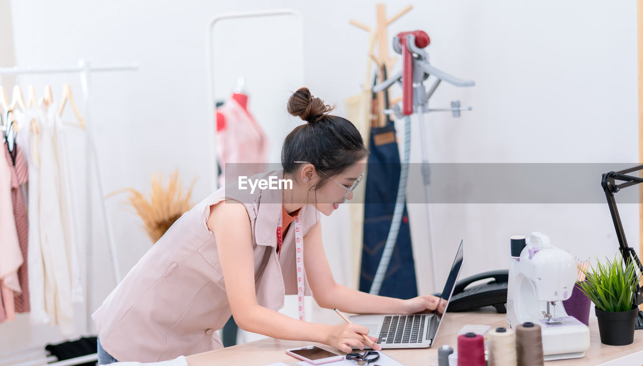 WOMAN WORKING IN TRADITIONAL CLOTHING