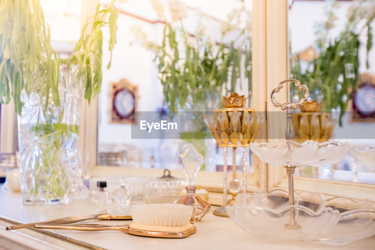 CLOSE-UP OF GLASSES ON TABLE