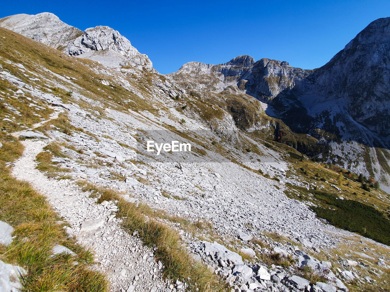 Autumn view of mountain pass and glacial scree