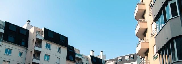 LOW ANGLE VIEW OF BUILDINGS AGAINST CLEAR SKY