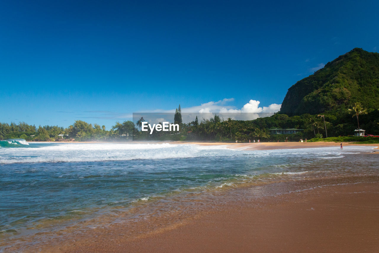 Scenic view of haena beach park on the hawaiian island of kauai, usa against blue sky