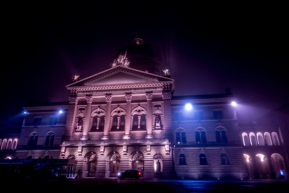 LOW ANGLE VIEW OF ILLUMINATED BUILDINGS