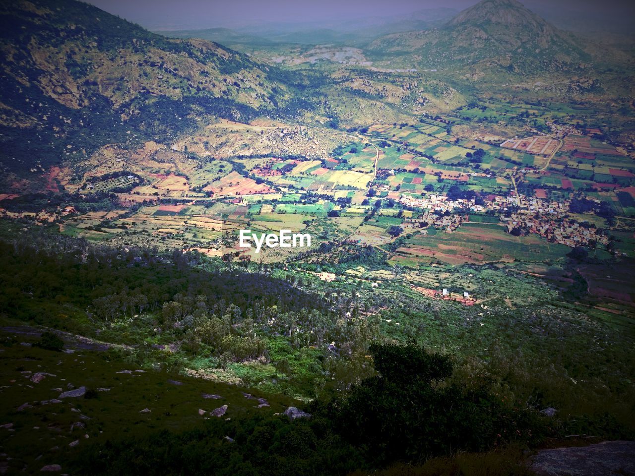 AERIAL VIEW OF FIELD AND MOUNTAIN