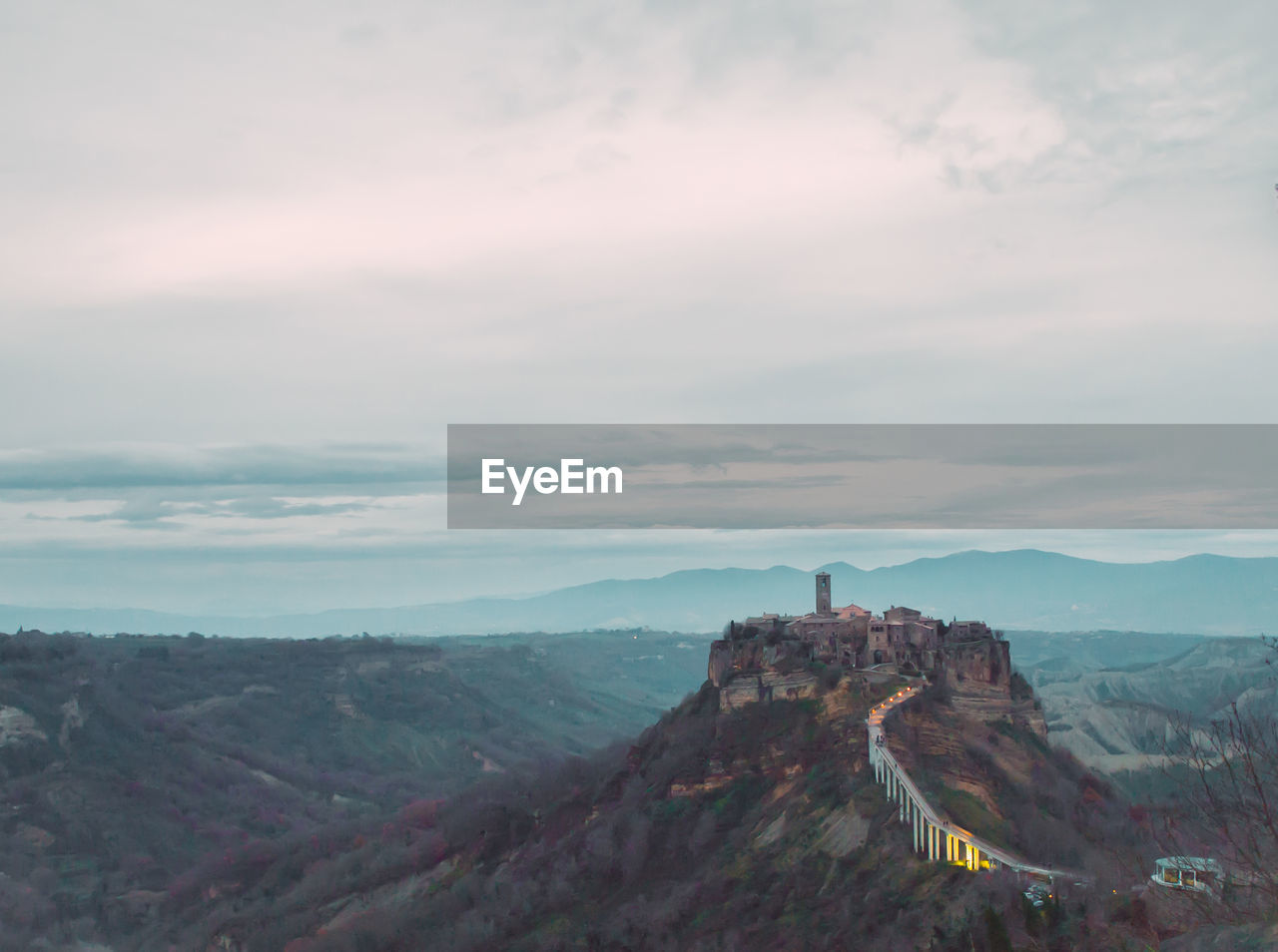 Scenic view of landscape against cloudy sky