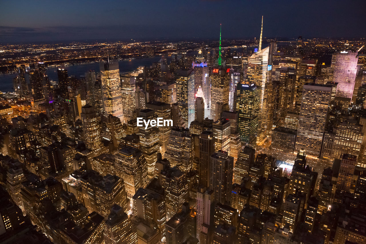 High angle view of illuminated cityscape at night