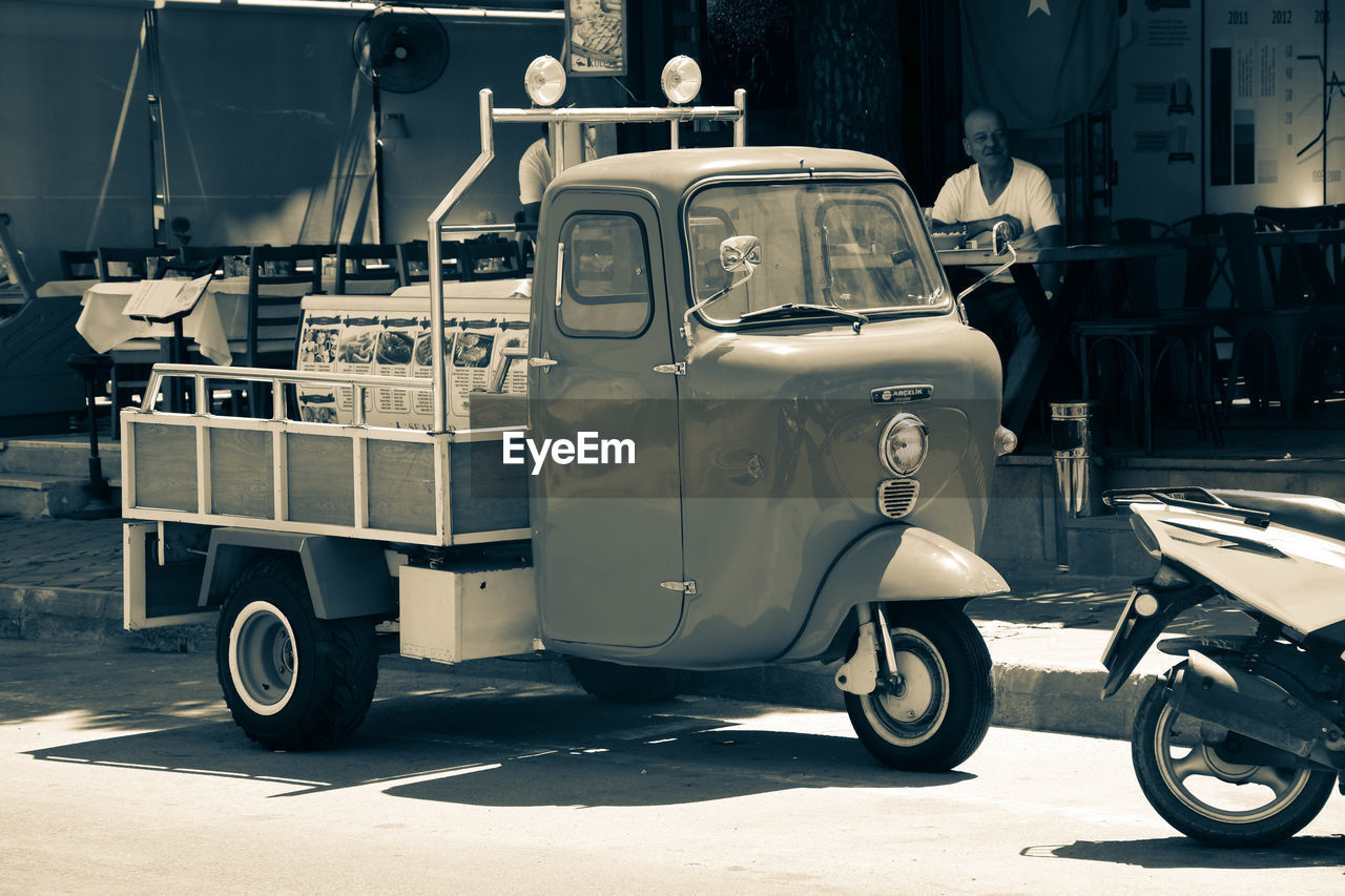 VINTAGE CAR PARKED ON STREET