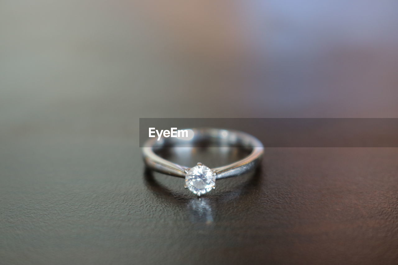 Asian woman holding a white gold engagement ring, pure gold, philippines