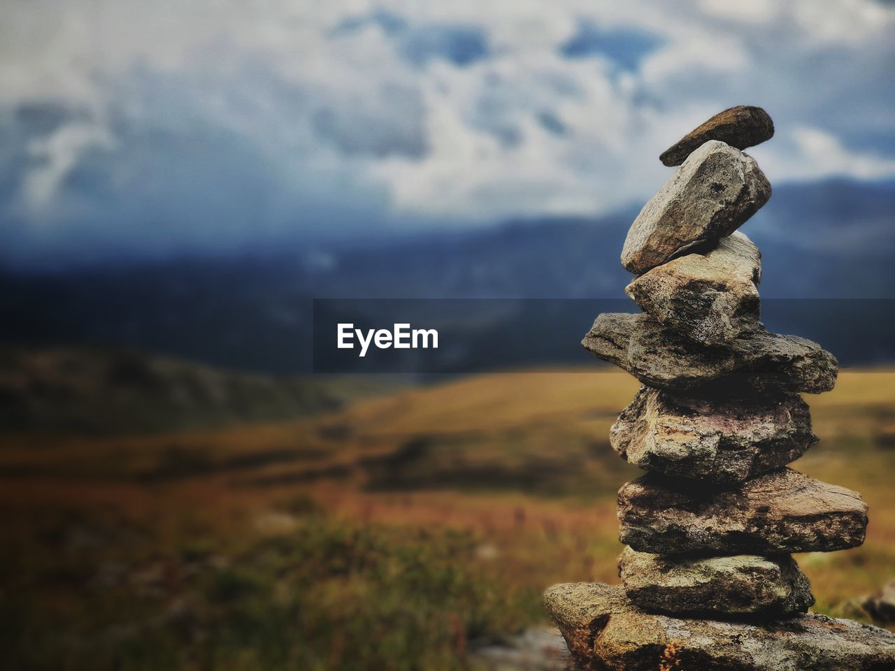 CLOSE-UP OF STONE STACK ON ROCK