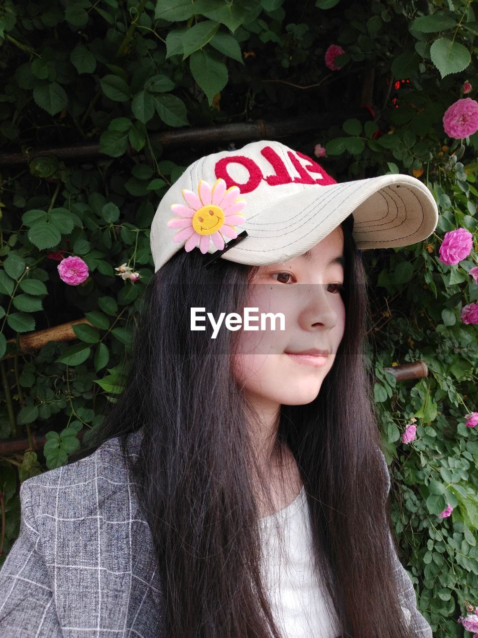 Smiling young woman wearing cap