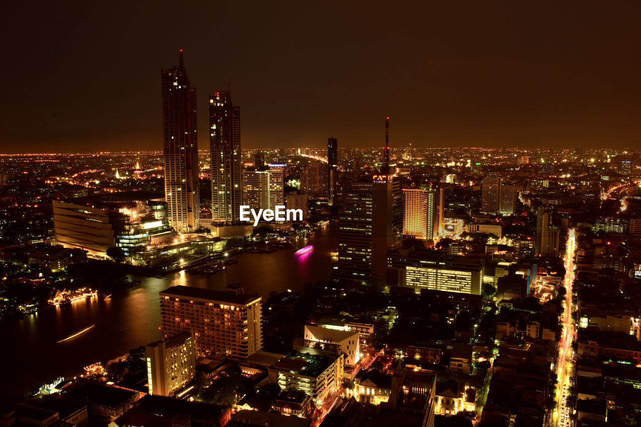 high angle view of illuminated cityscape at night