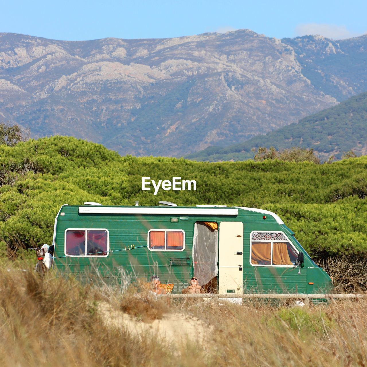 Motor home against mountains