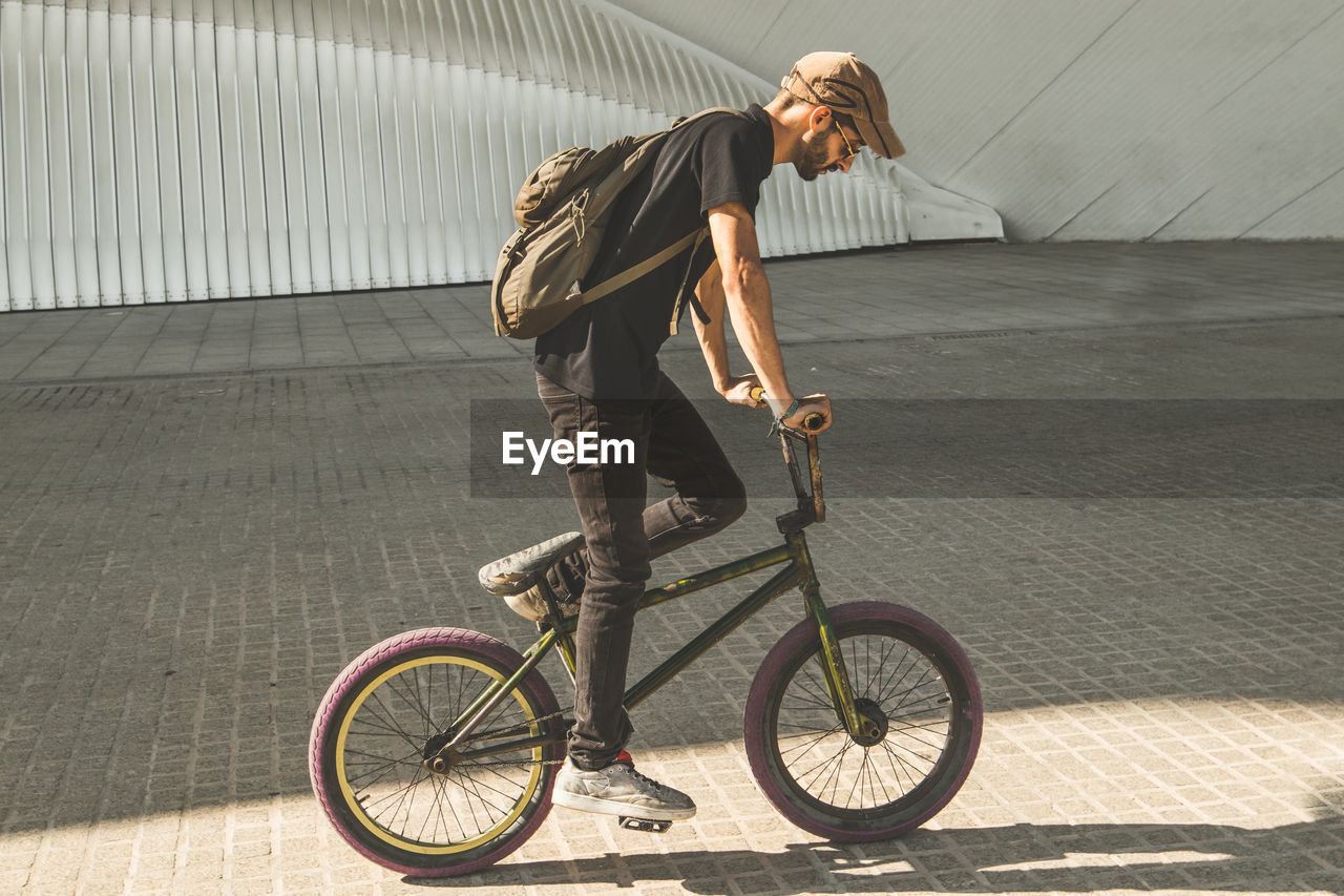 Man riding bicycle in city