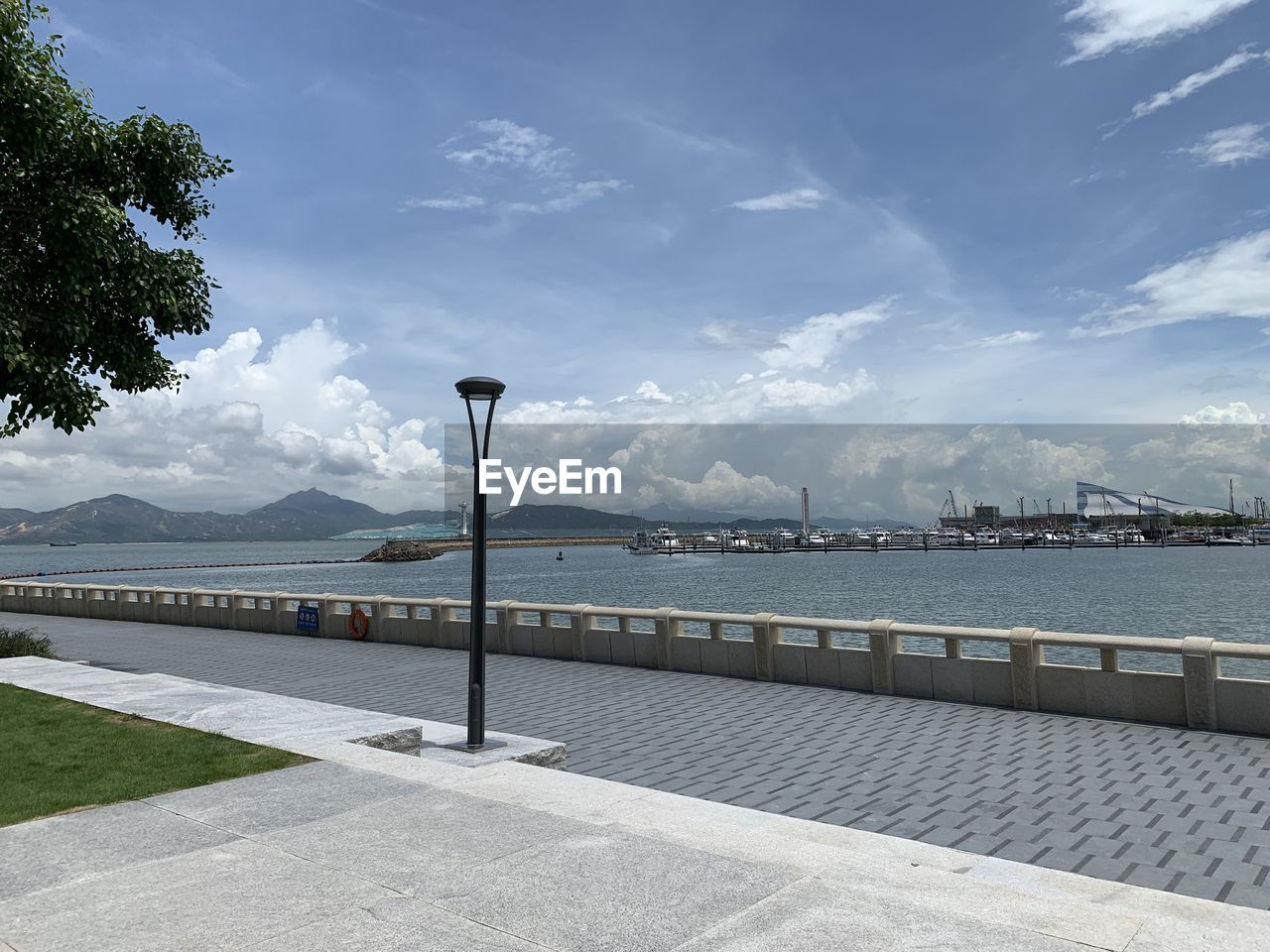 STREET AMIDST SEA AGAINST SKY