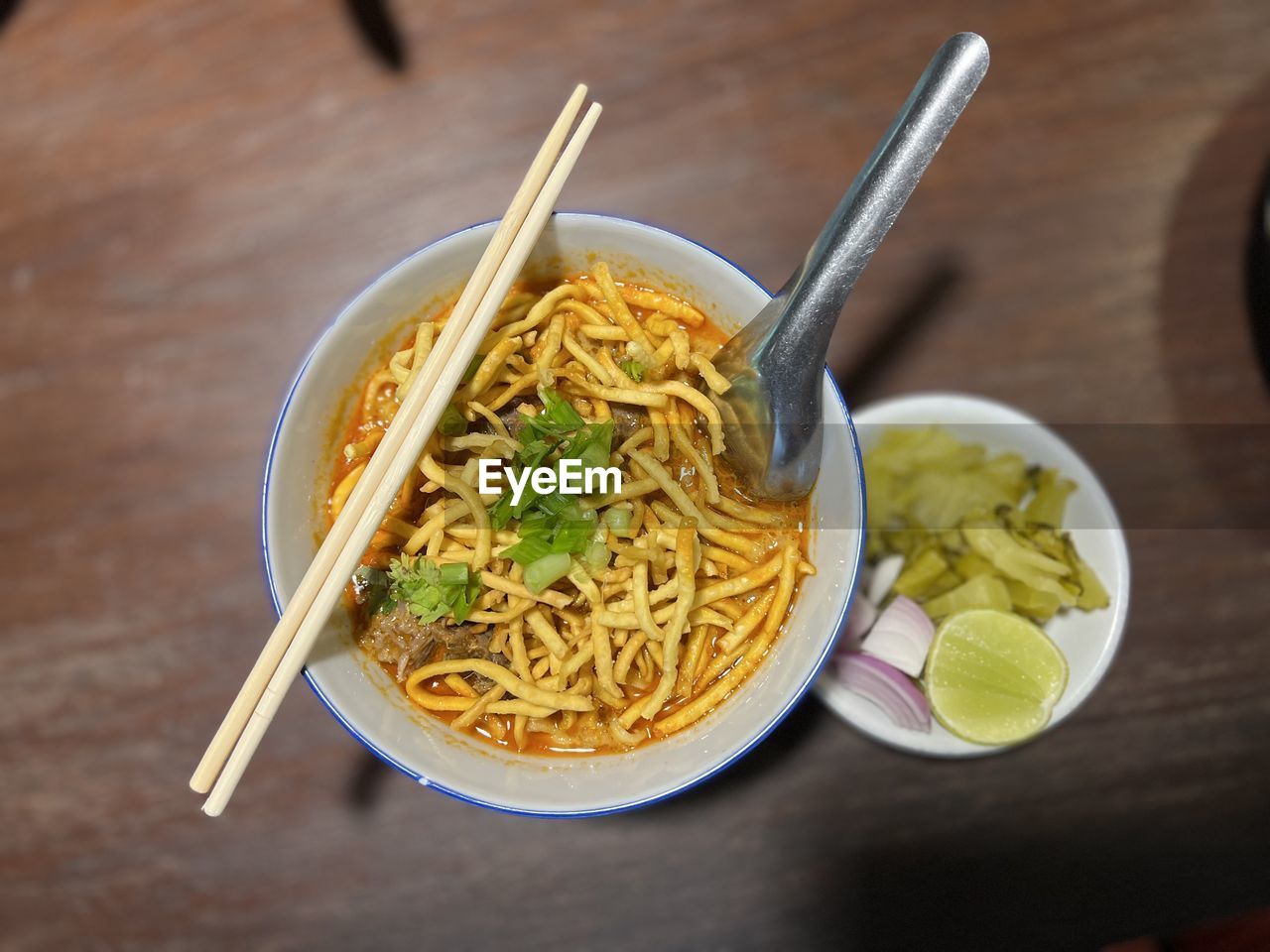 food and drink, food, pasta, italian food, healthy eating, dish, wellbeing, kitchen utensil, eating utensil, bowl, cuisine, freshness, wood, spoon, table, meal, noodle, asian food, indoors, no people, vegetable, high angle view, chopsticks, plate, crockery, produce, close-up, spaghetti, studio shot, ramen noodles, pancit, herb, spice, soup, savory food, household equipment, still life