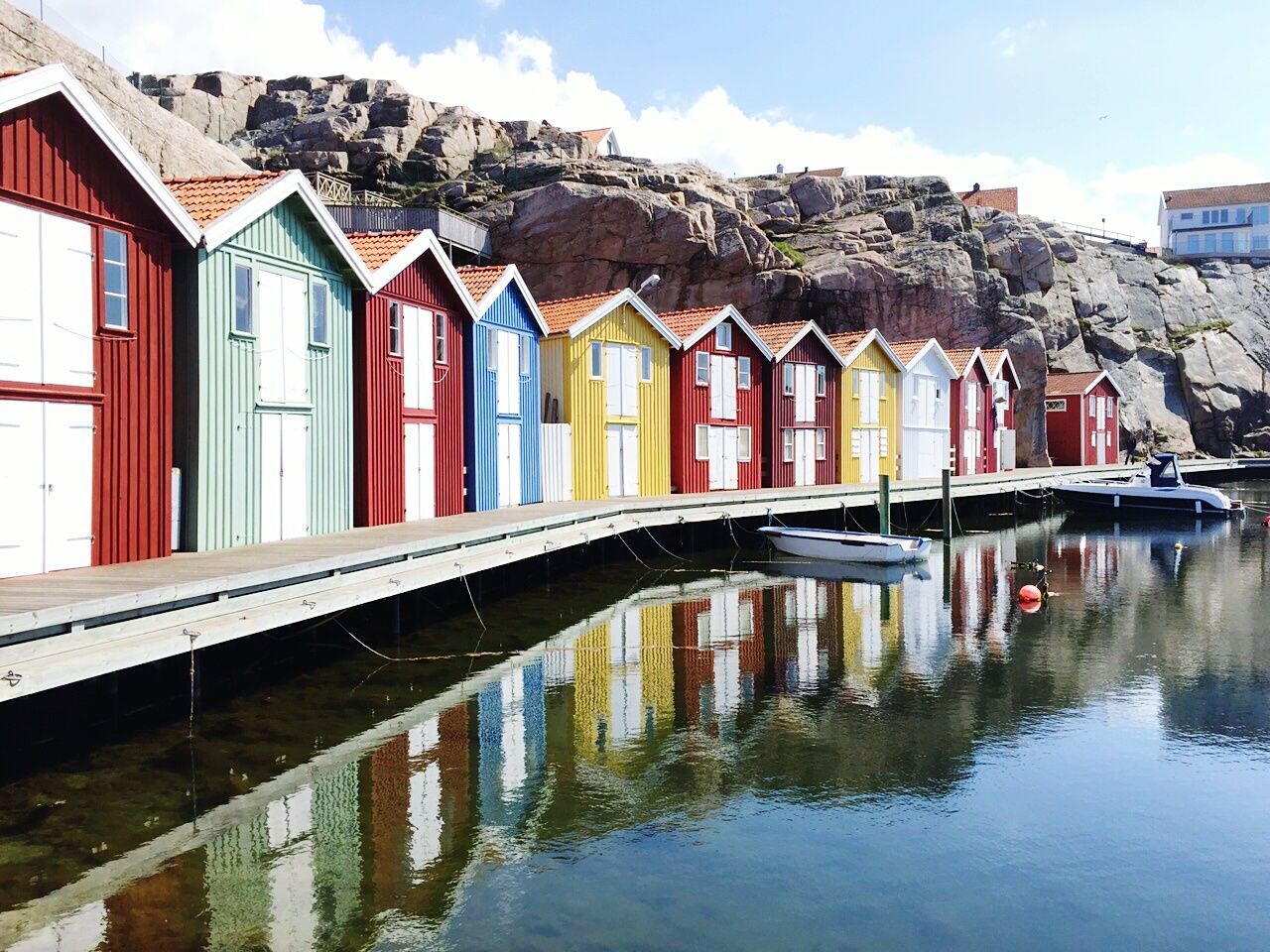 Wooden houses by lake