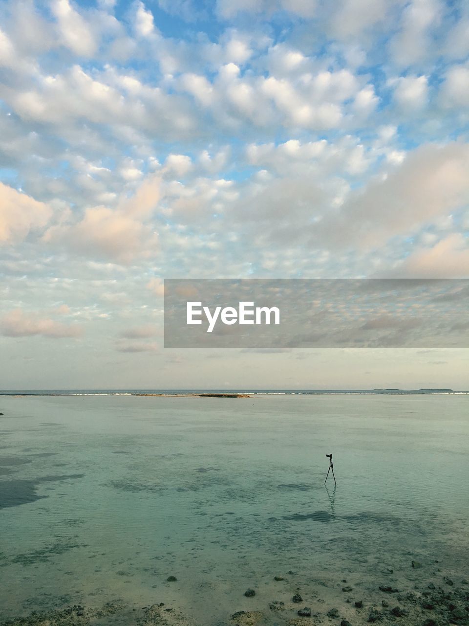 VIEW OF SEA AGAINST CLOUDY SKY