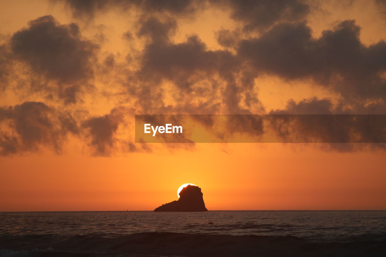 SCENIC VIEW OF SEA DURING SUNSET