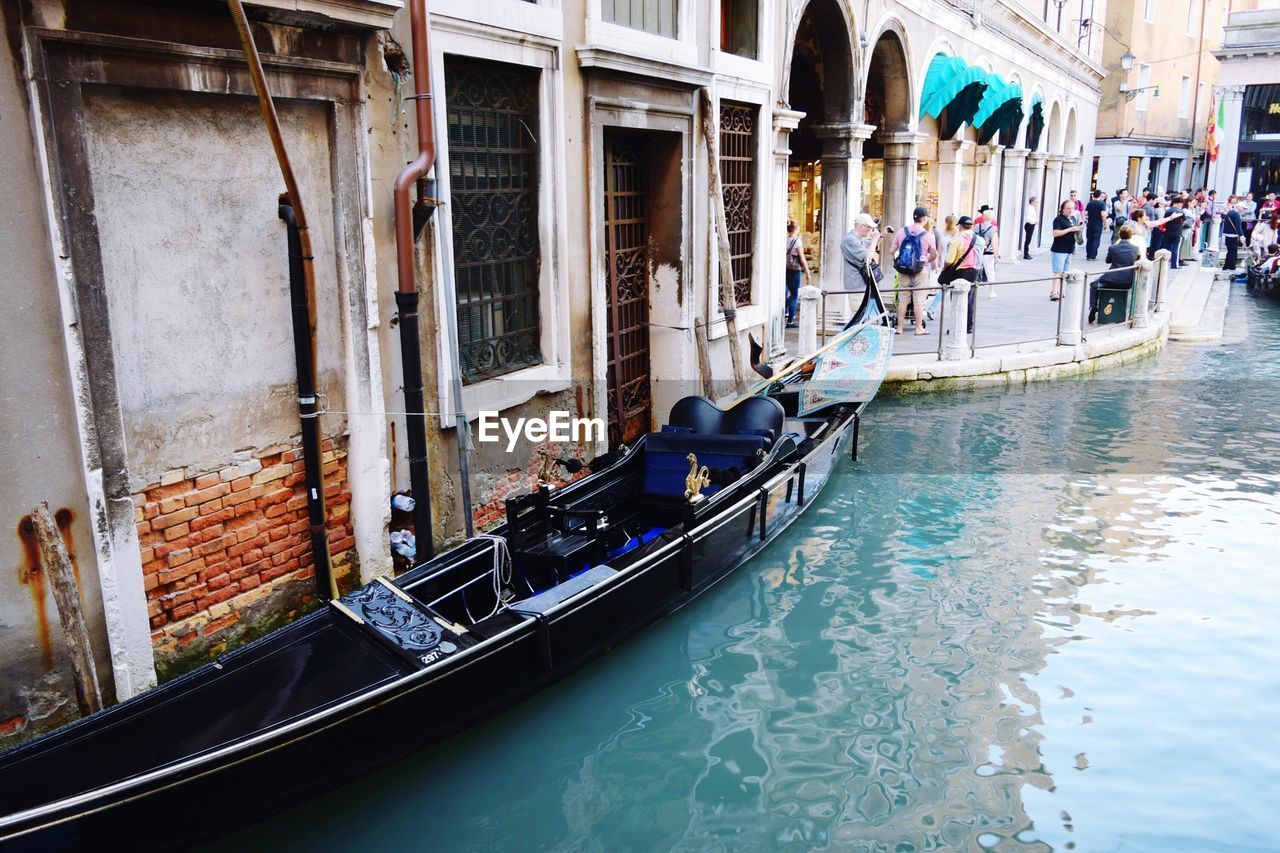 PEOPLE IN BOAT ON CANAL