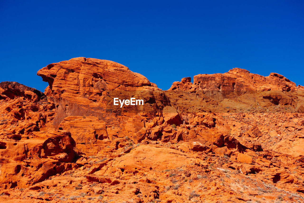 Low angle view of rock formation against clear sky at valley of fire state park