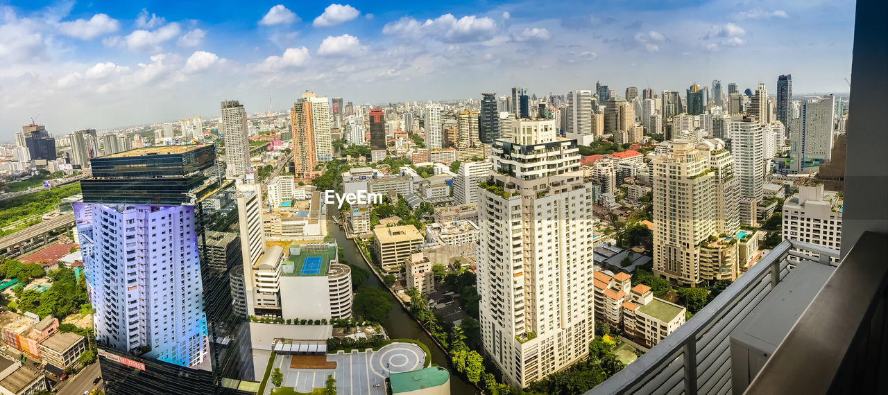 MODERN CITYSCAPE AGAINST SKY