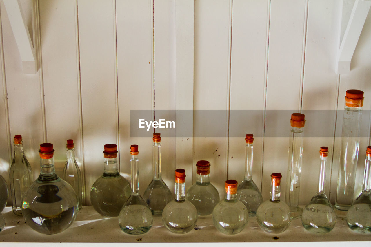 Close-up of glass bottles in row