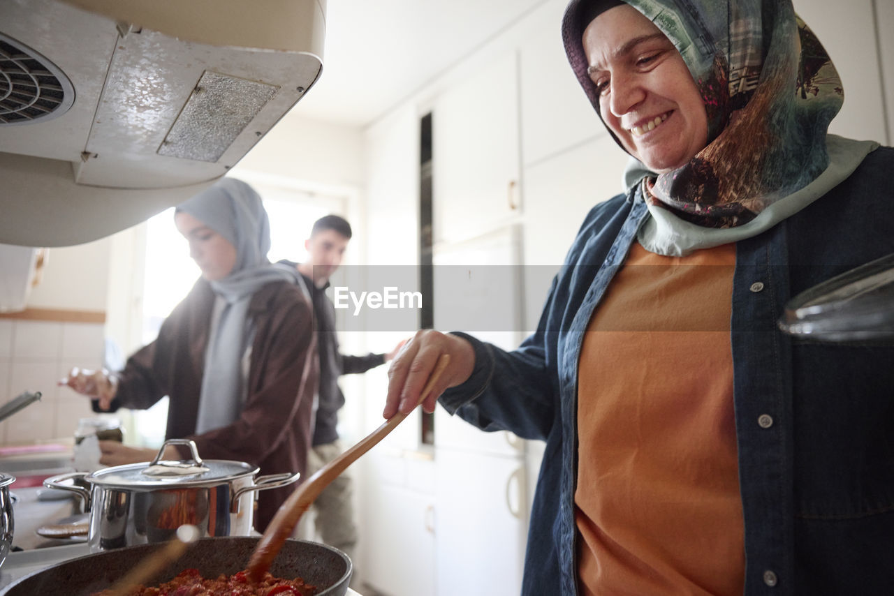 Family cooking together for eid al-fitr at home