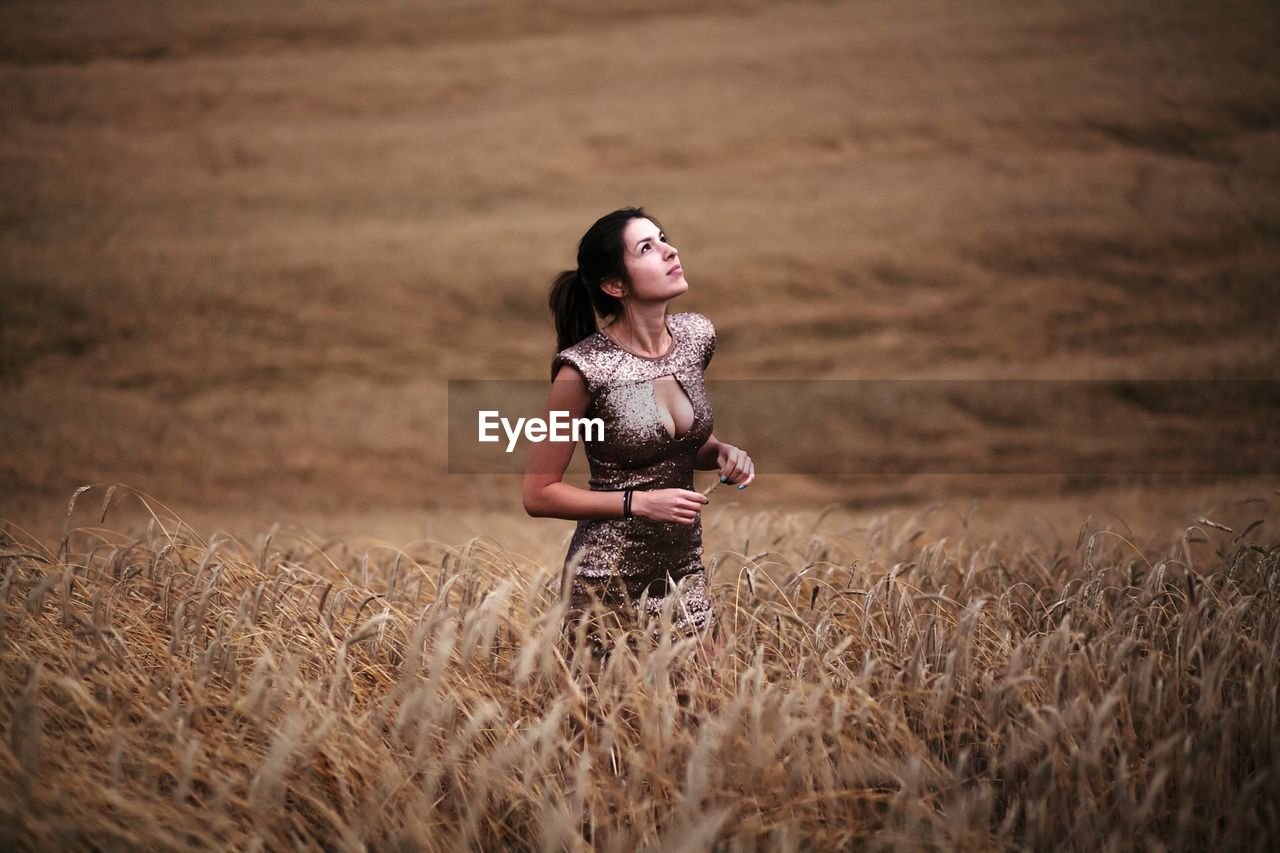 Woman standing on field