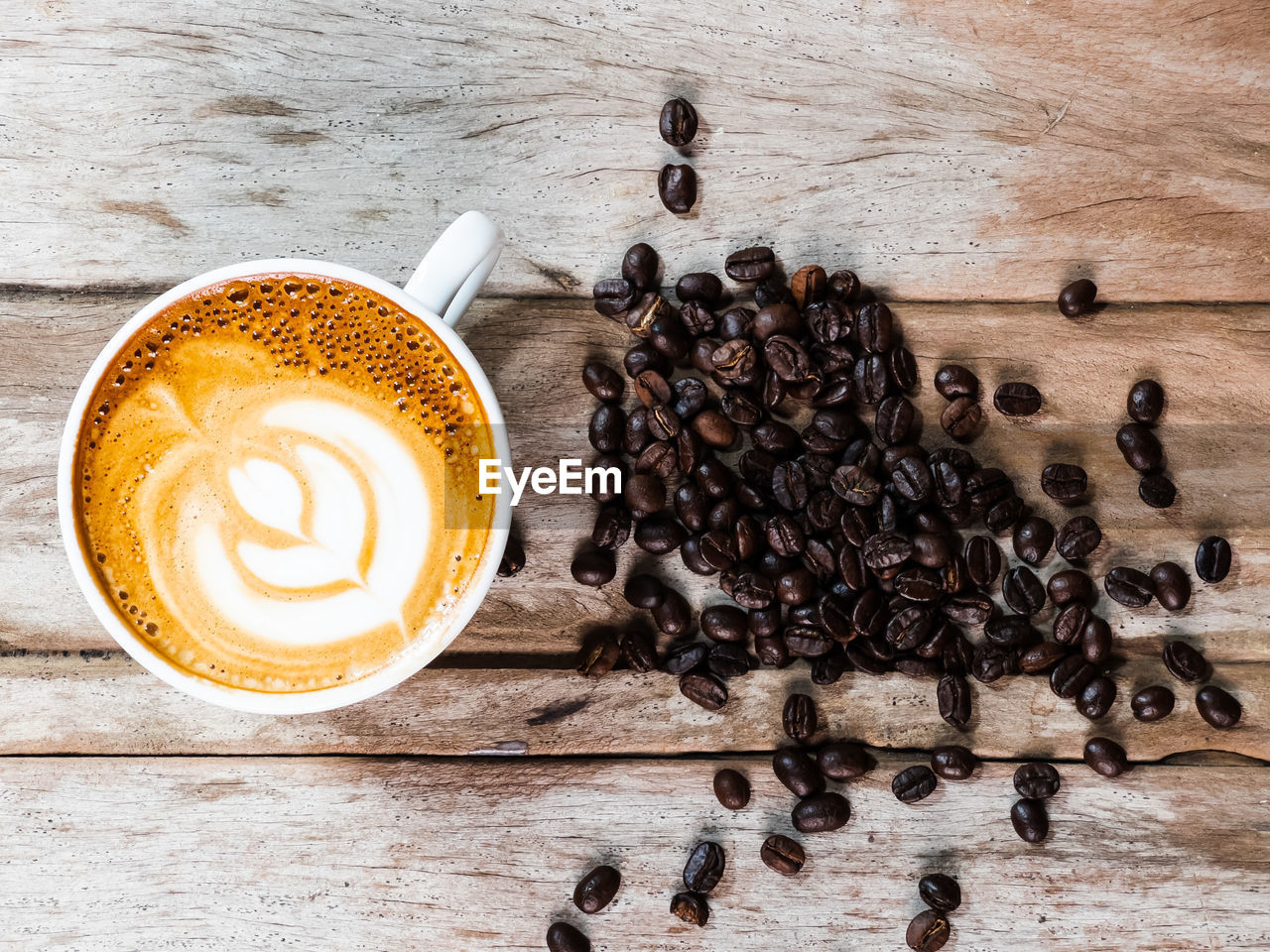 DIRECTLY ABOVE SHOT OF COFFEE CUP WITH TEXT ON TABLE