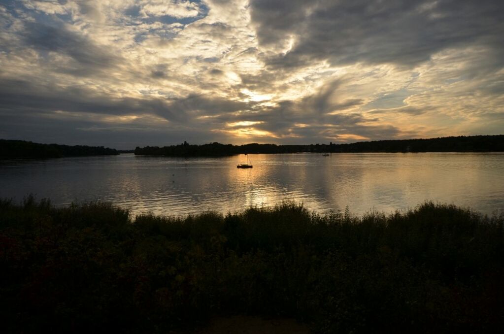 SCENIC VIEW OF LAKE AT SUNSET