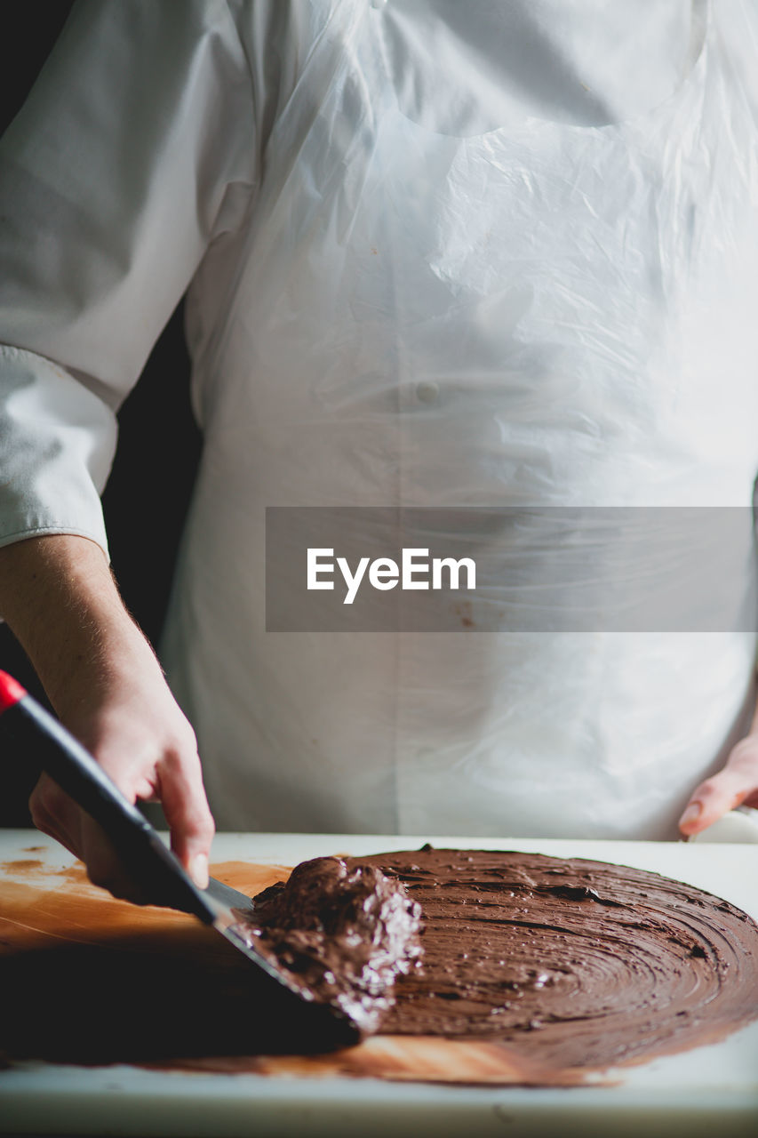 Close-up of chef making chocolate dessert