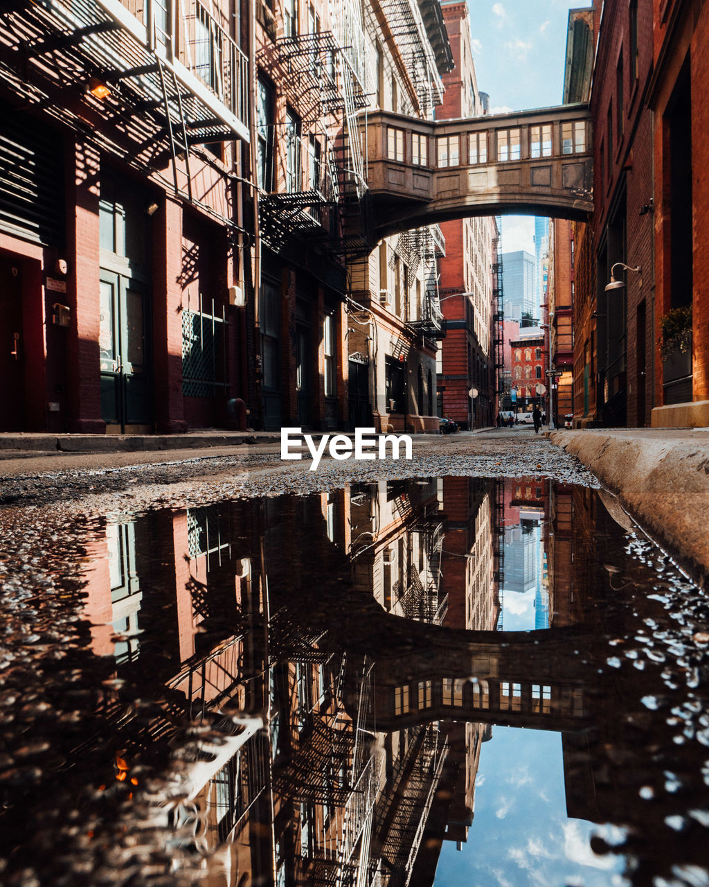 Reflection of buildings in puddle