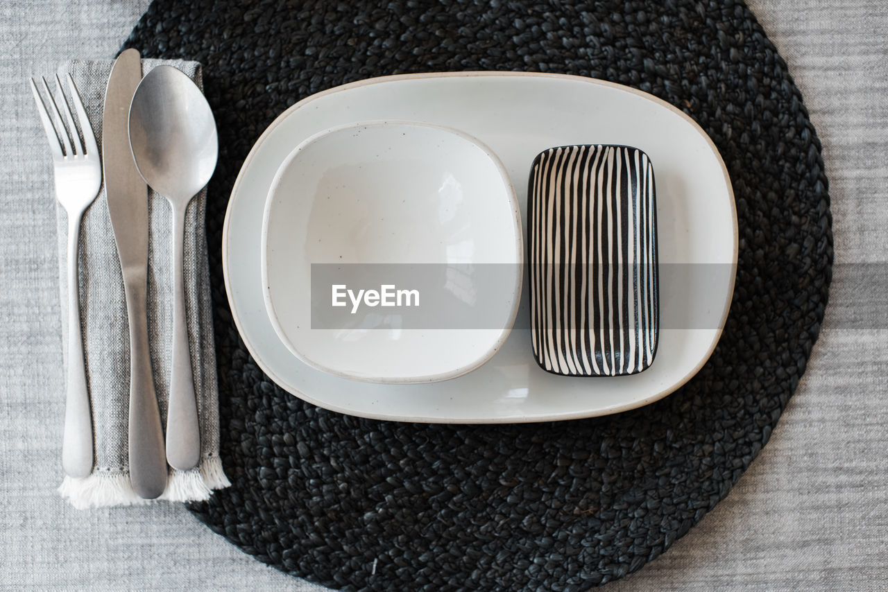 Black and white dinner table place setting