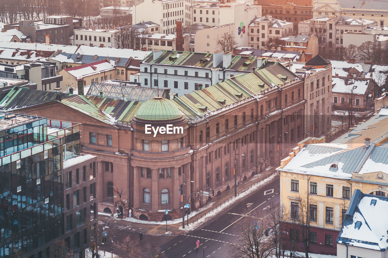 HIGH ANGLE VIEW OF STREET AND BUILDINGS IN TOWN