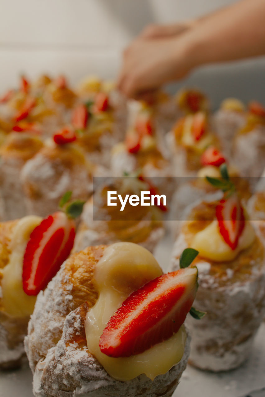 CLOSE-UP OF STRAWBERRIES ON TABLE