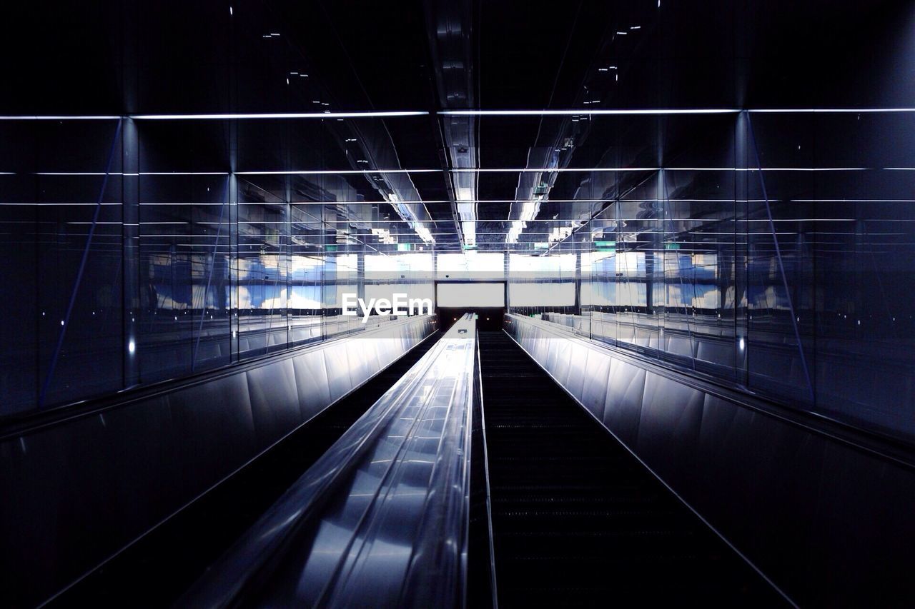 Illuminated escalator in building