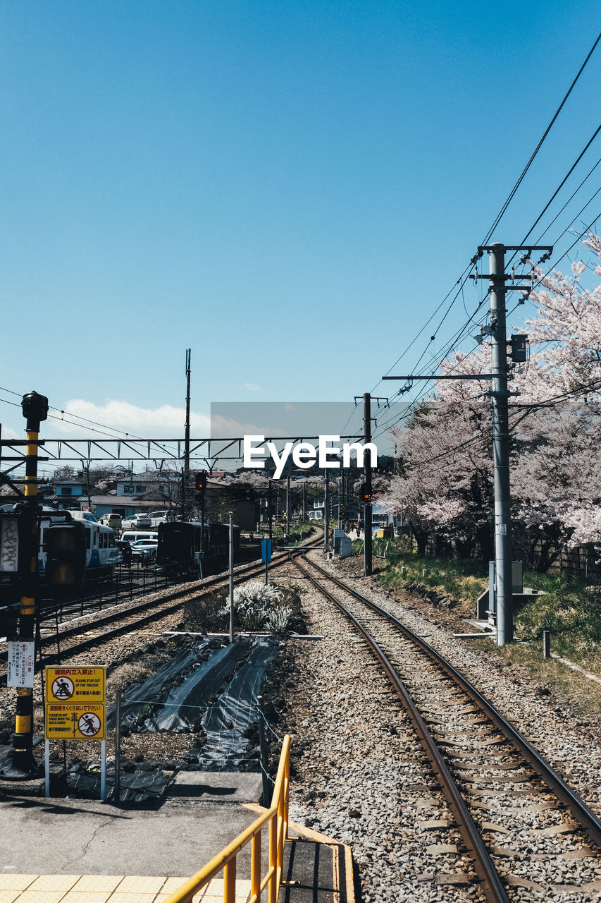 RAILWAY TRACKS AGAINST CLEAR SKY