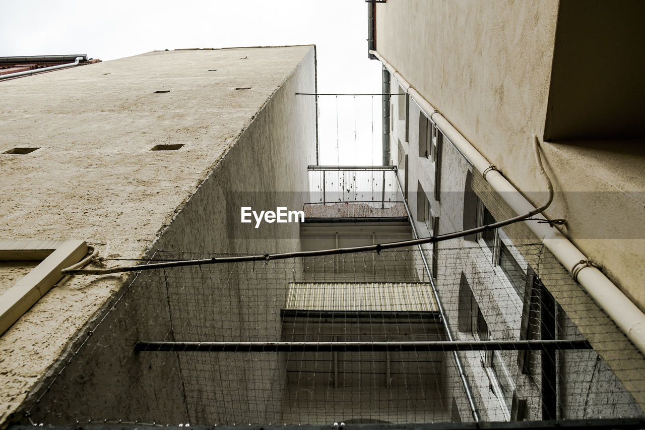 VIEW OF BUILDINGS THROUGH WINDOW