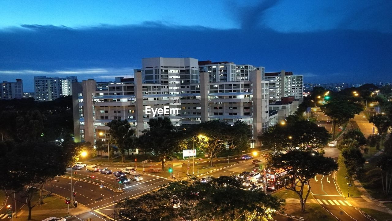 HIGH ANGLE VIEW OF ILLUMINATED CITY STREET