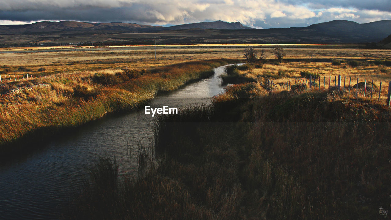 Scenic view of river and mountains