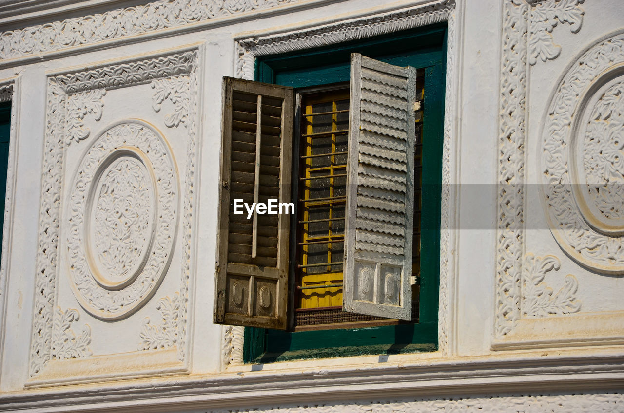 Low angle view of building window