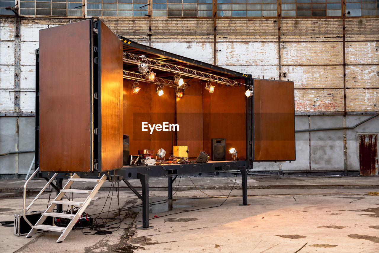 Illuminated stage in abandoned building