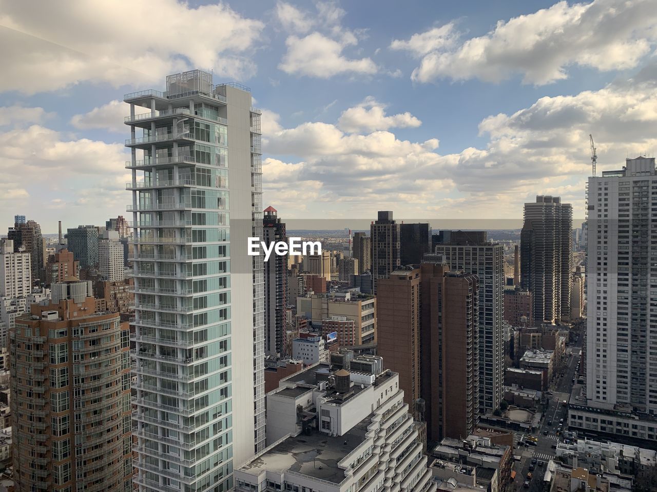 High angle view of buildings in city against sky