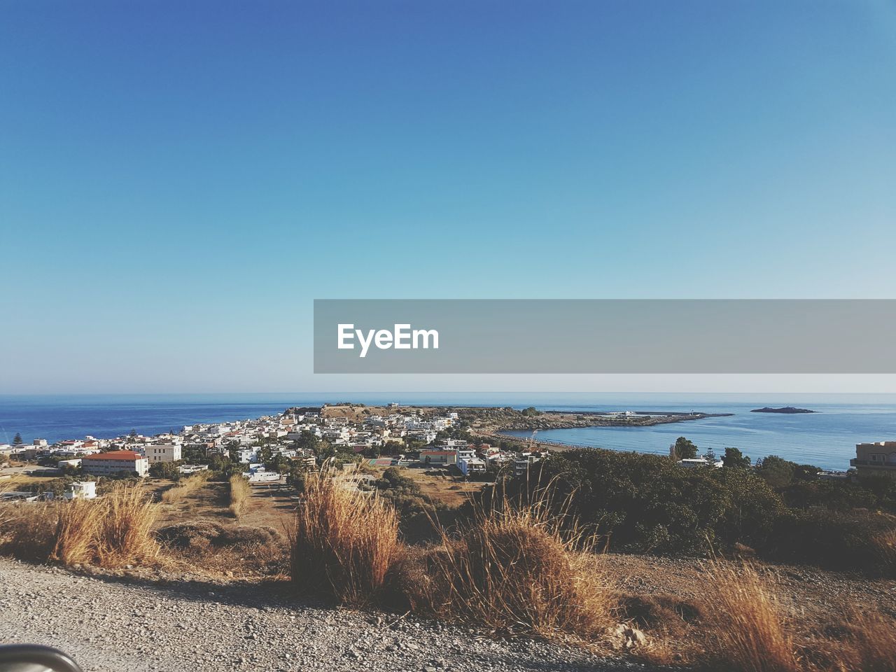 Scenic view of sea against clear blue sky