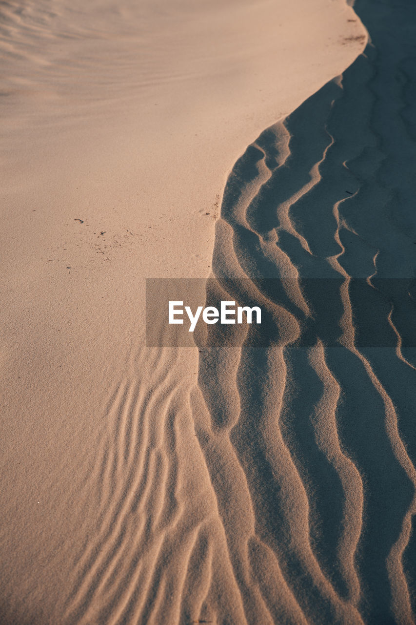 High angle view of sand dunes at beach