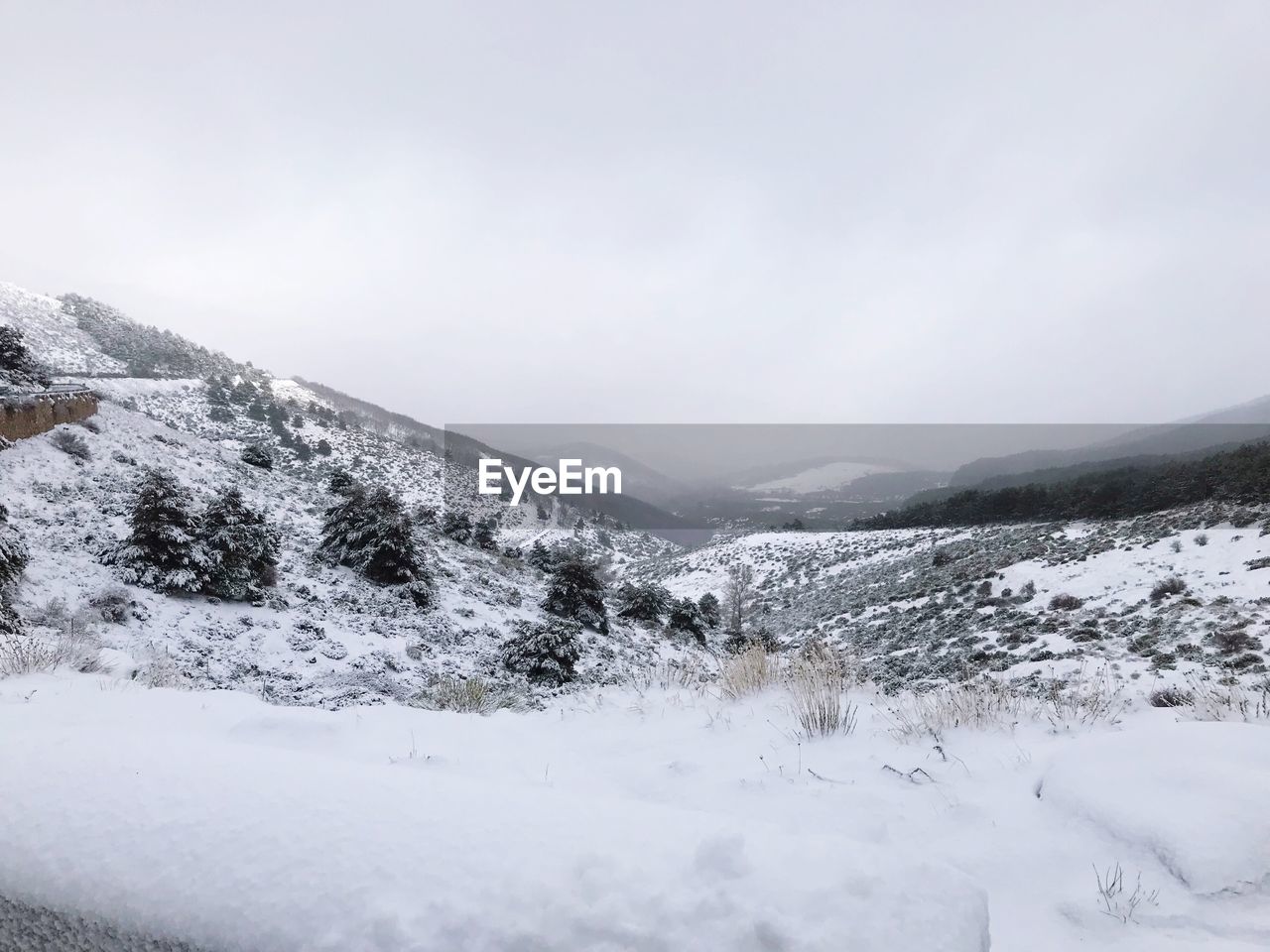 Scenic view of snow covered mountains against sky