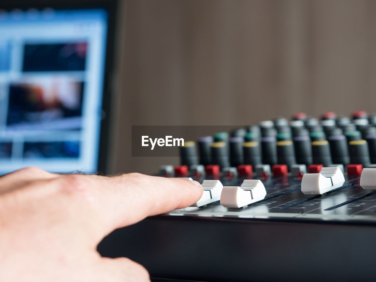 Close-up of man playing sound mixer