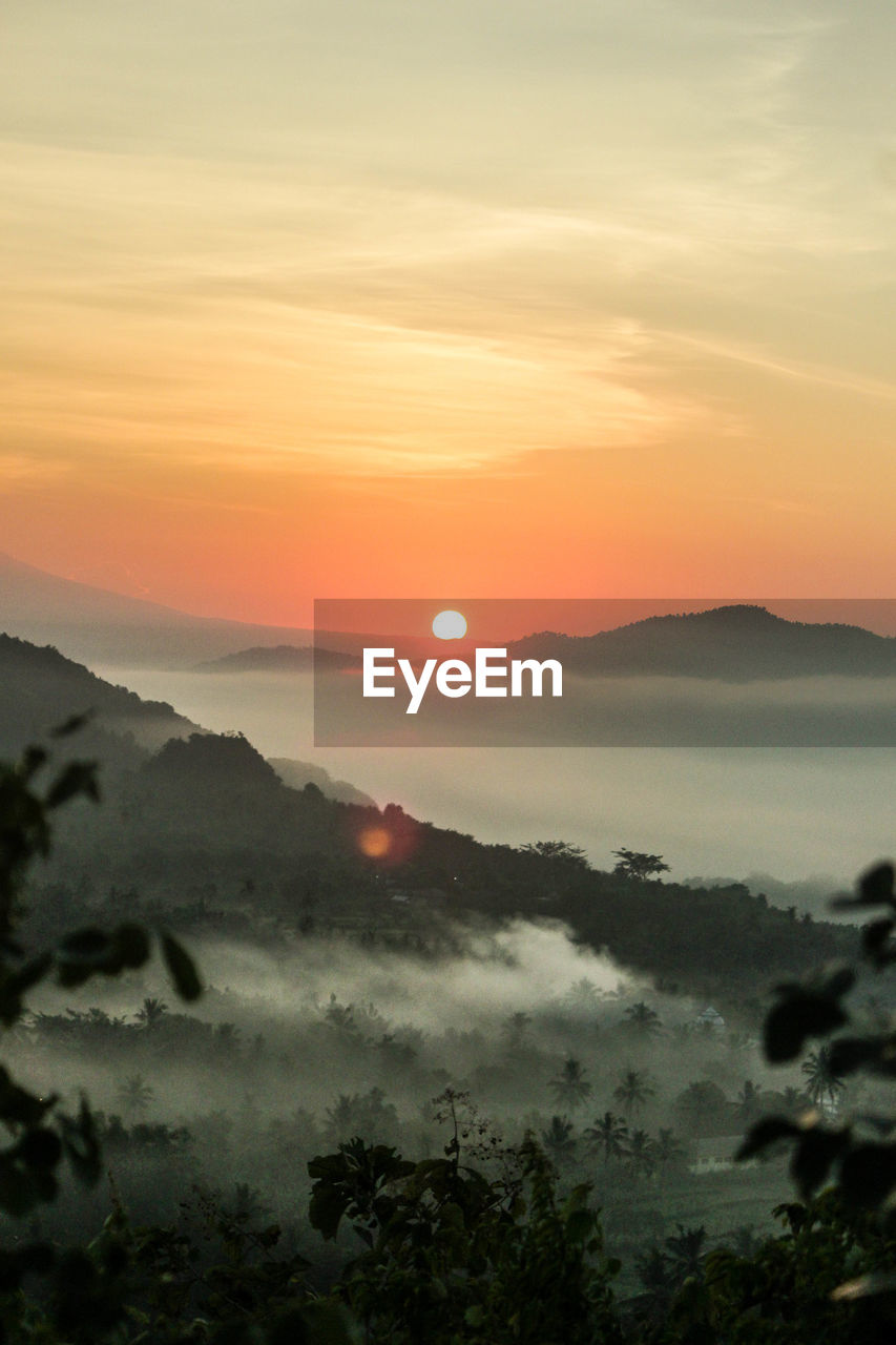 Scenic view of mountains against sky during sunset