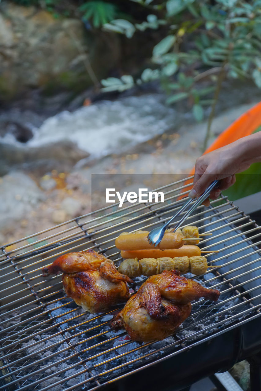 High angle view of meat on barbecue grill