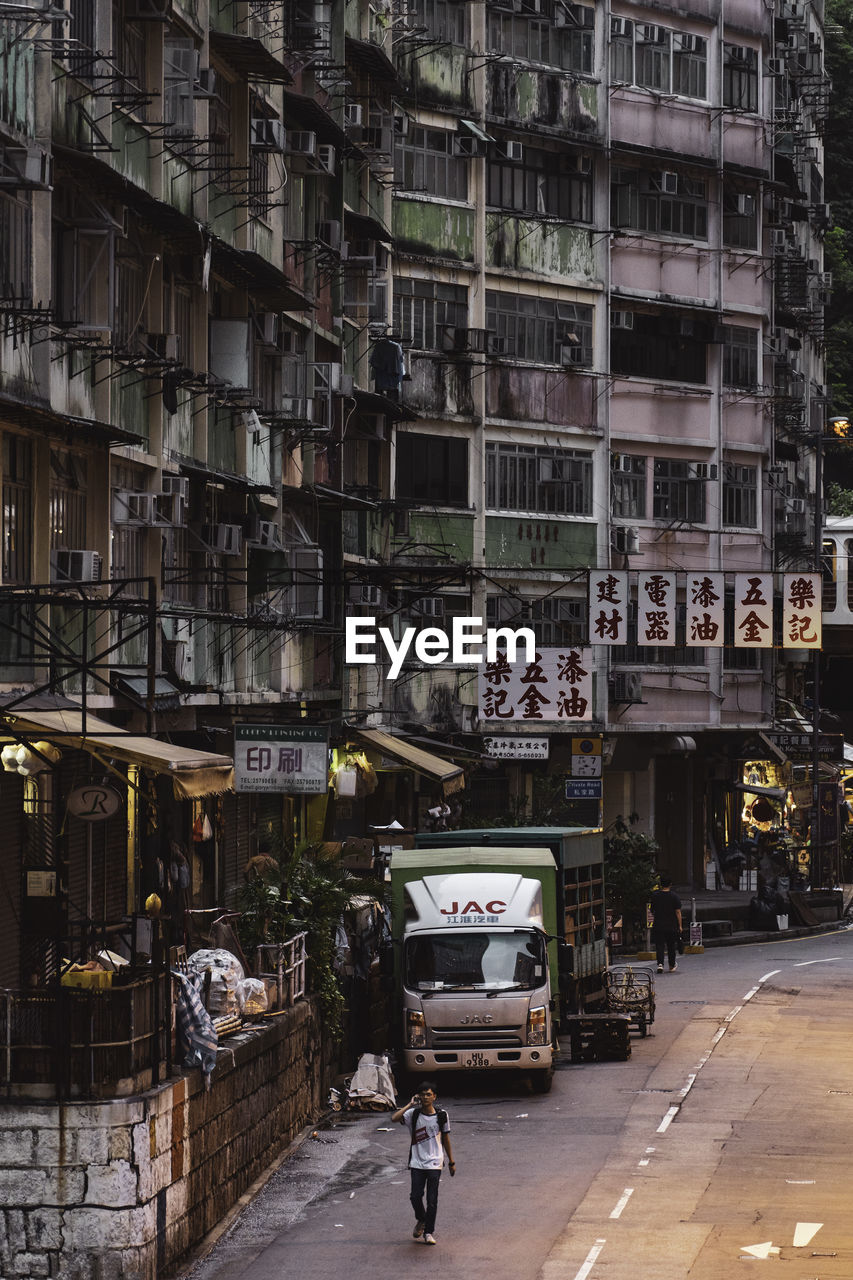 STREET AMIDST BUILDINGS IN CITY